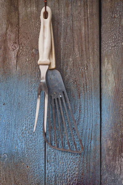 Vintage kitchen items hanging on a nail
