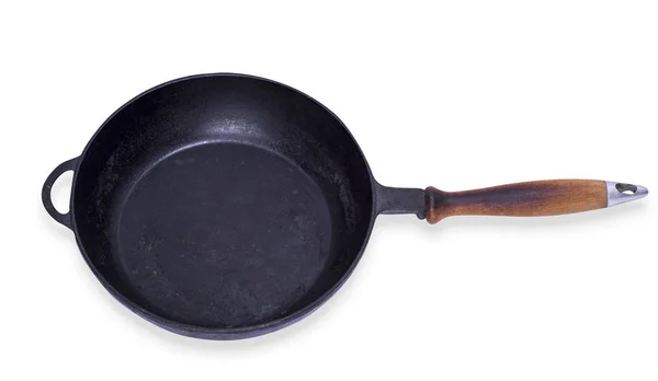 Empty round cast iron frying pan with wooden handle — Stock Photo, Image