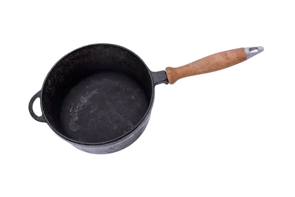 Deep old black cast iron frying pan with wooden handle — Stock Photo, Image