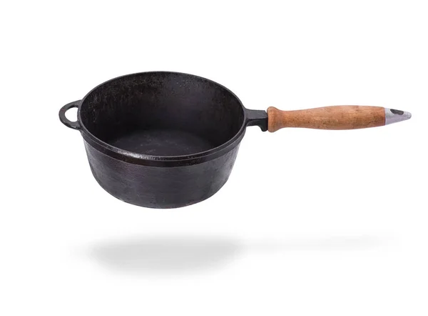 Deep old black cast iron frying pan with wooden handle — Stock Photo, Image