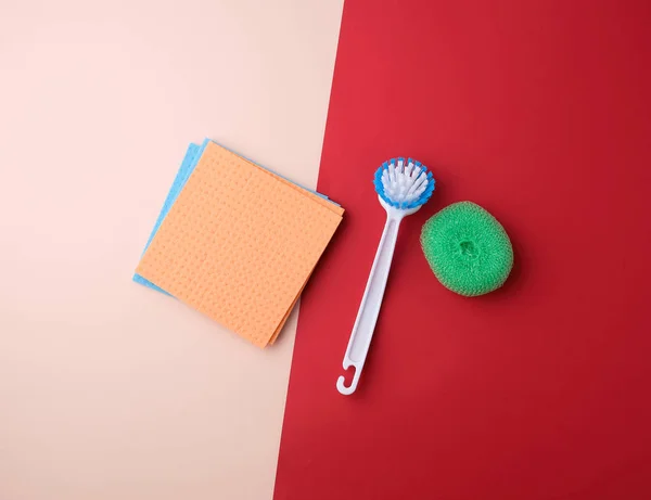Items for home cleaning: brush, multi-colored sponges for dustin — Stock Photo, Image