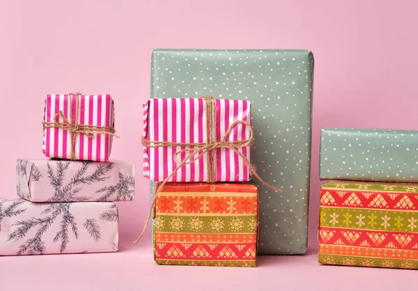 Stack of colored paper wrapped gift boxes — Stock Photo, Image