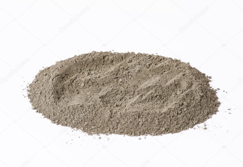 pile of gray dry Crimean fine clay on a white background