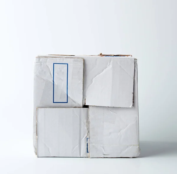 White crumpled cardboard box with a closed lid — Stock Photo, Image