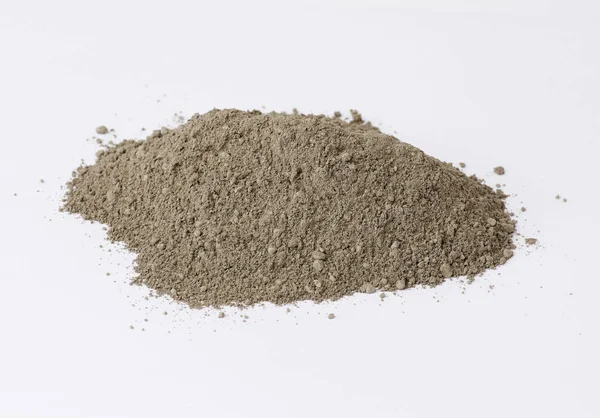 Pile of gray dry Crimean fine clay on a white background — Stock Photo, Image