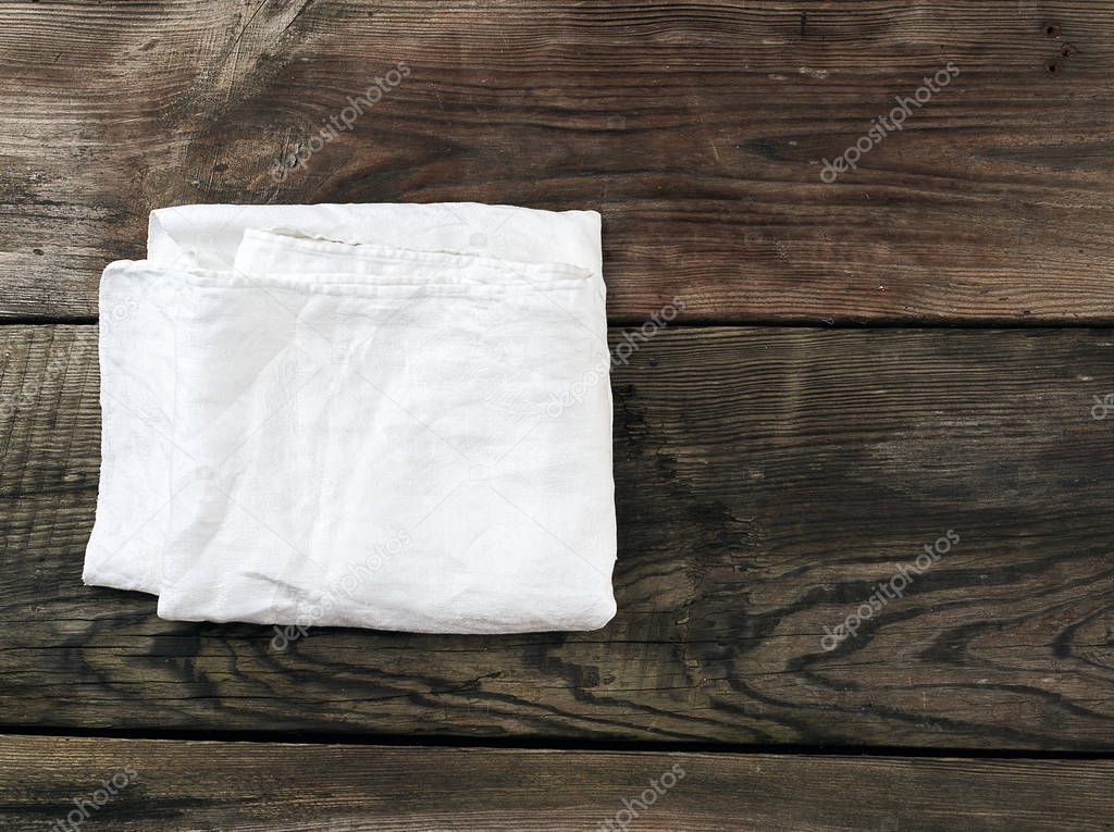 white kitchen textile towel folded on a gray wooden table from o
