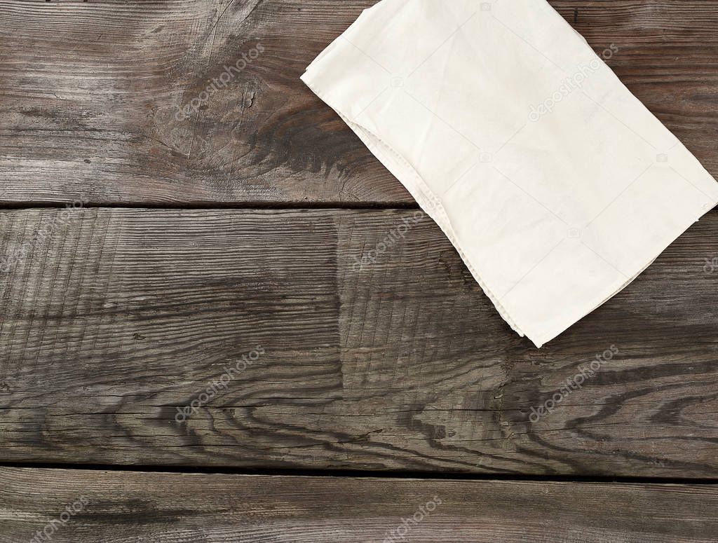 white kitchen textile towel folded on a gray wooden table from o