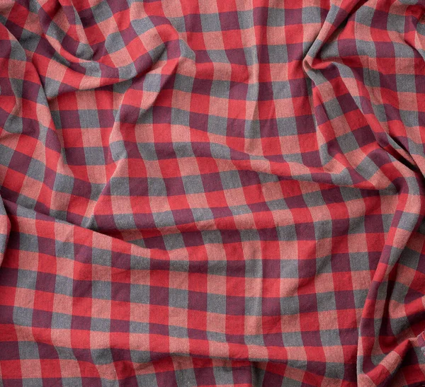 Rood geruite stof voor het naaien van diverse kleding met golven — Stockfoto