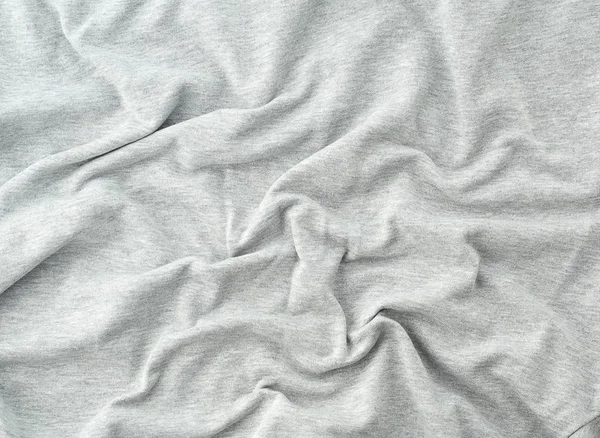 Šedá bavlněná elastická tkanina pro šití oděvů, plátno s vlnami — Stock fotografie