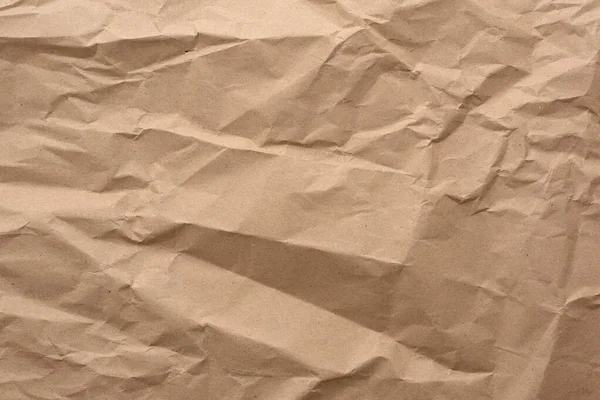 Fragment zmačkaného prázdného listu hnědého balicího papíru kraft — Stock fotografie