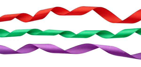 Zestaw skręconych jedwabnych czerwonych, zielonych, fioletowych wstążek izolowanych na białym — Zdjęcie stockowe