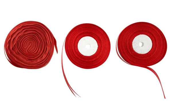 Three coils with silk red ribbon isolated on white background — 스톡 사진