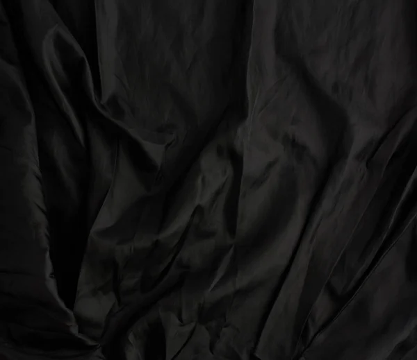 Textura černé bavlněné tkaniny s vlnami, plný rám — Stock fotografie