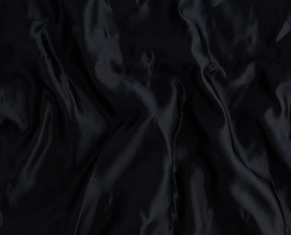 Black satin textile fabric, piece of fabric for sewing curtains — 스톡 사진