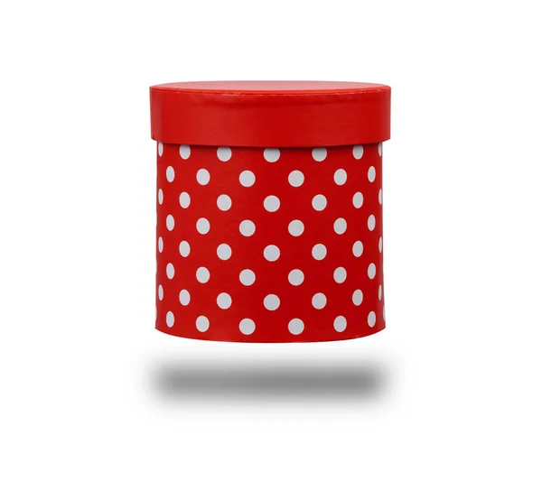 Red cardboard box with white polka dots in the shape of a cylind — 스톡 사진