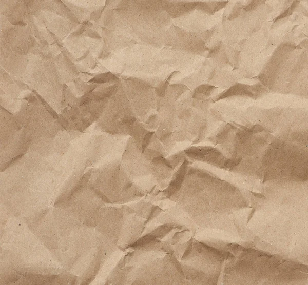 Fragment zmačkaného prázdného listu hnědého balicího papíru kraft — Stock fotografie