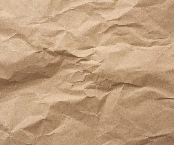 Fragment of crumpled blank sheet of brown wrapping kraft paper — 스톡 사진