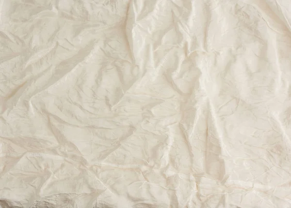 crumpled beige synthetic fabric for the manufacture of lining fo