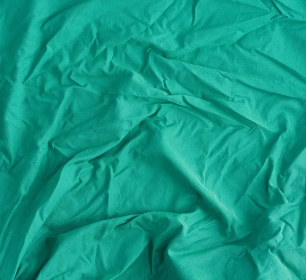 Crumpled light green cotton fabric — 스톡 사진