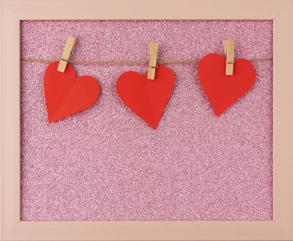 Carved red paper hearts hanging on a brown rope — Stock Photo, Image