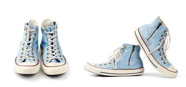 Пара світло-блакитних текстильних кросівок з шнурками та блискавками — стокове фото