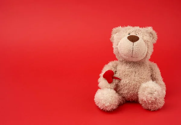 Cute Little Brown Teddy Bear Toy Sitting Red Background Close — Stock Photo, Image