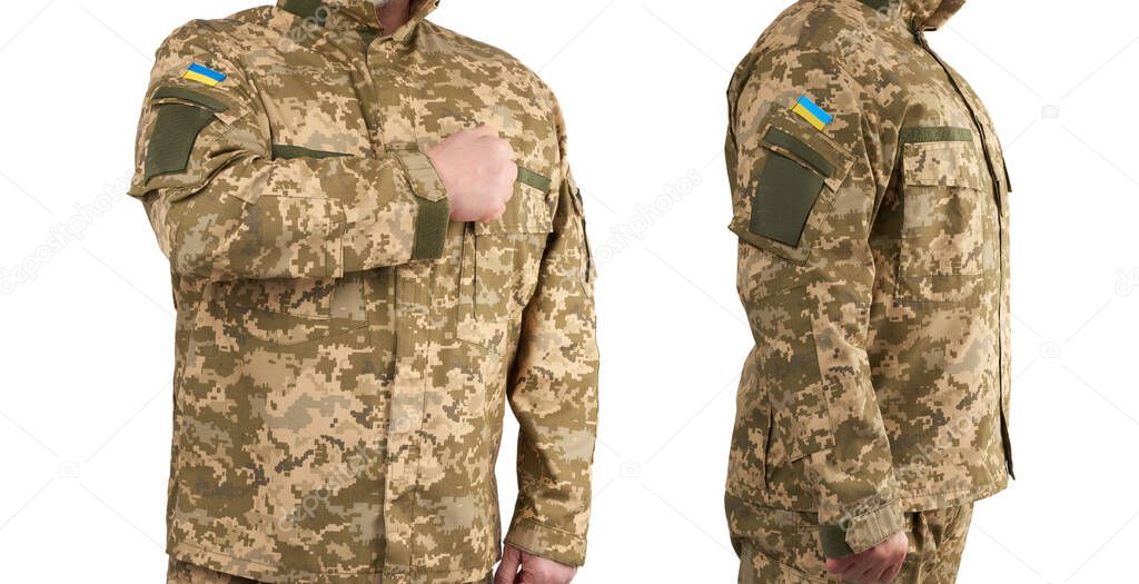 Ukrainian man warrior dressed in a military pixel uniform stands on a white background, soldier put a hand to his chest as a sign of respect, honor of the state symbol