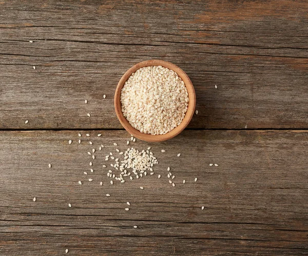 Dry White Sesame Seeds Brown Wooden Bowl Gray Wooden Table — Stock Photo, Image