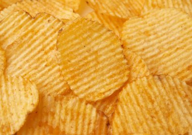 Yuvarlak kızarmış patates cipsi dokusu, tam kare, yakın çekim.