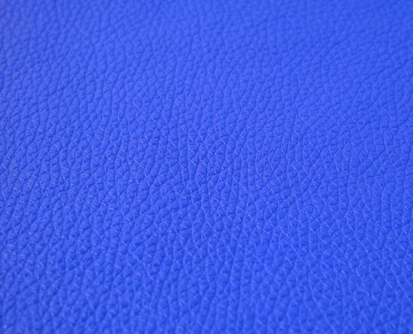 texture of dark blue cow leather, full frame, material for sewing bags, shoes, selective focus