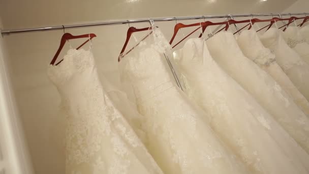 Wedding dresses in bridal boutique — Stock Video