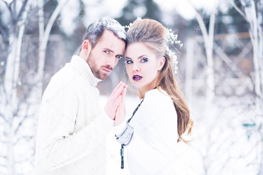 Young beautiful couple, guy and girl, embraces, love and winter
