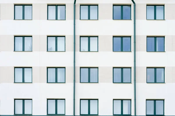 modern hospital or bank building with green windows