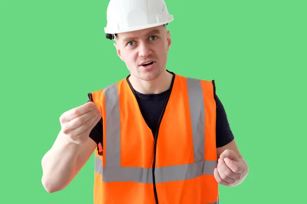 angry builder worker foreman in orange protectiive cask and work