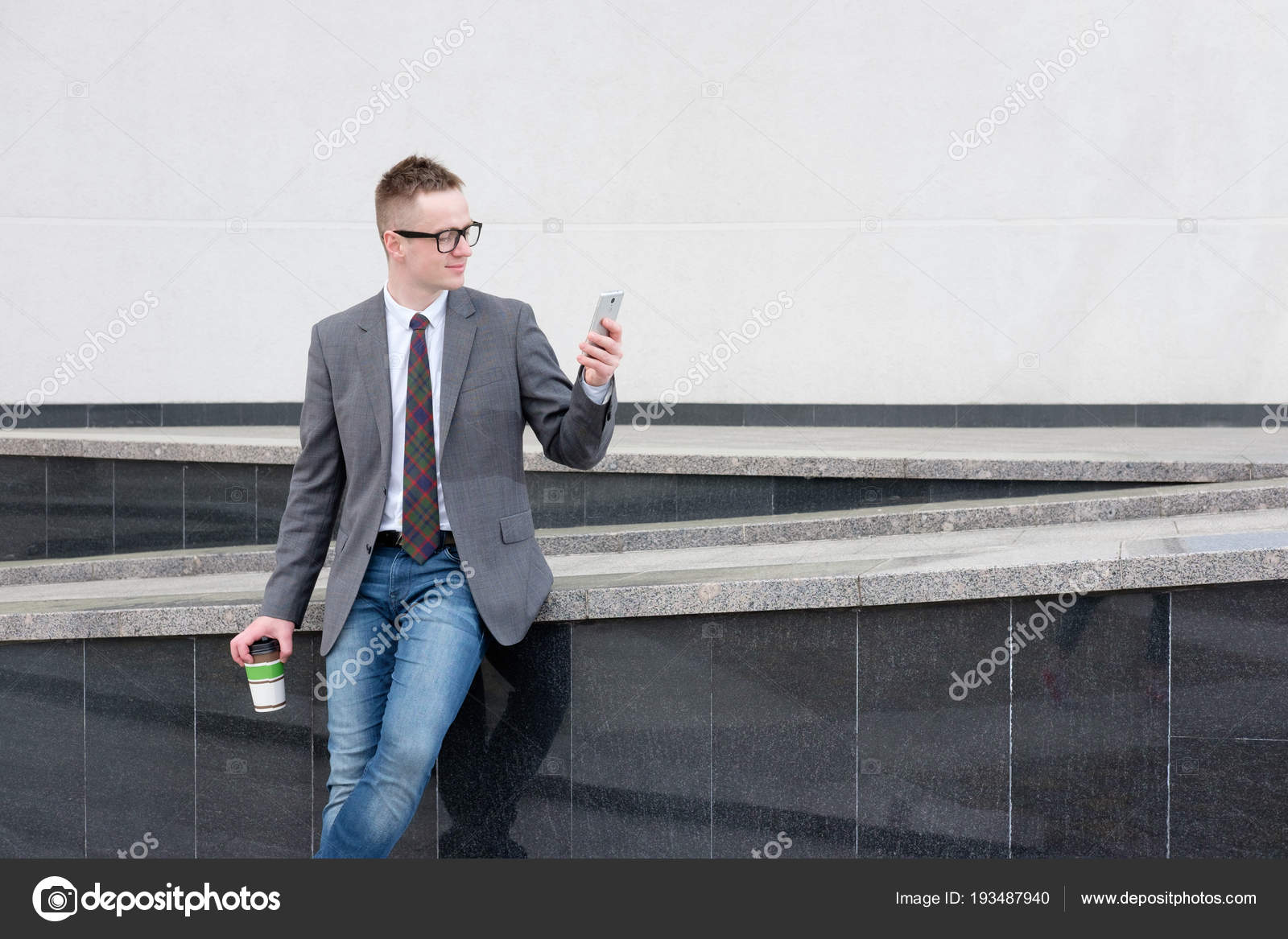 gray jacket blue jeans