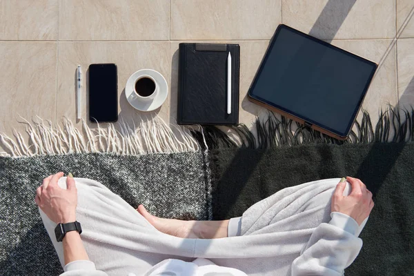 Caucasian woman has morning meditation in pajama before working