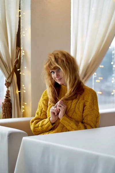 Redhead beautiful smiling girl with freckles wearing yellow swea — Stock Photo, Image