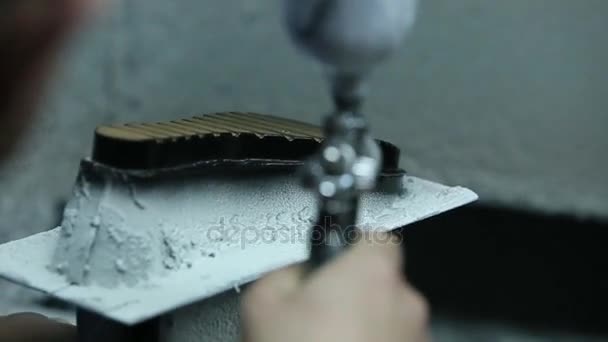 Slow motion of the painting soles of shoes. Handmade labor. — Stock Video