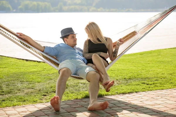 Contented couple relaxing in a hammock