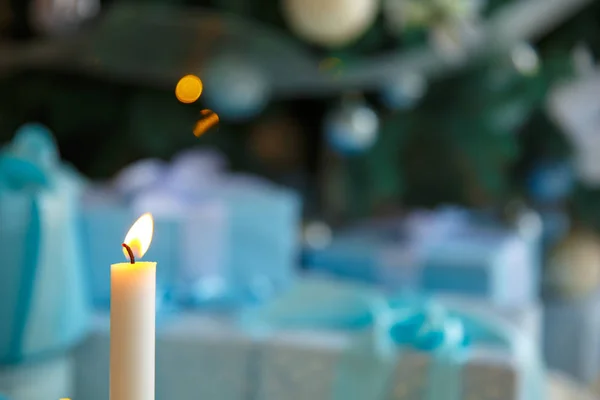 Christmas candle and lights. Prophecy Candle. Decoration on a bokeh background. — Stock Photo, Image