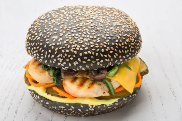 Black burger with chicken grill, pickle, spinach cheese, carrot — Stock Photo, Image