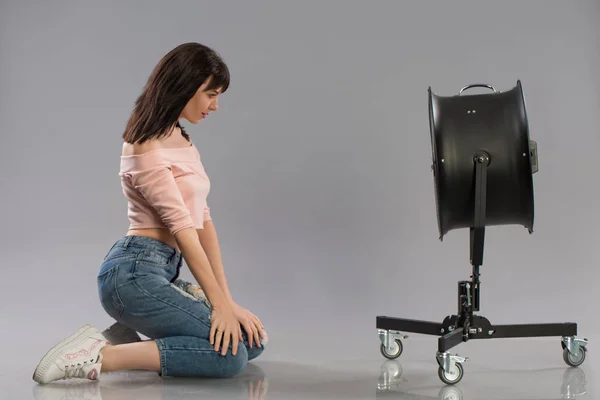 Young sexy female model posing with working fan — Stock Photo, Image