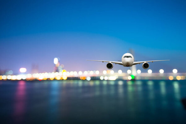 perspective view of jet airliner in flight with bokeh background