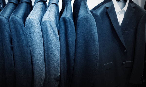 Pastel Color Clothes. Female Clothes on Open Clothes Rail