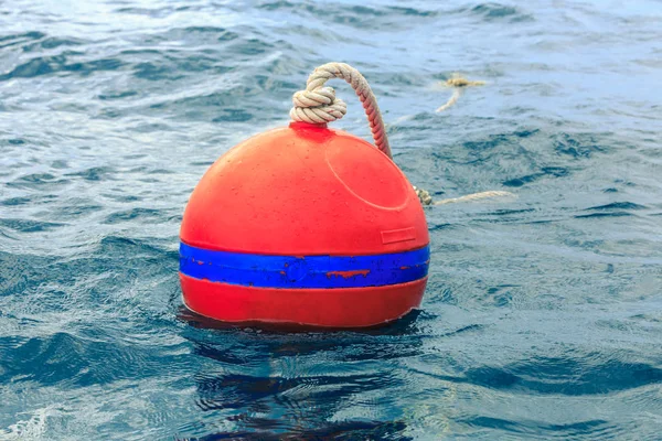 Orange buoy on blue sea — Stock Photo, Image