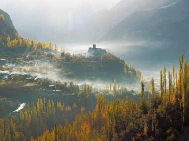 Altit Fort With Surrounding Mist And Hunza Valley In Autumn, Karimabad, Pakistan clipart