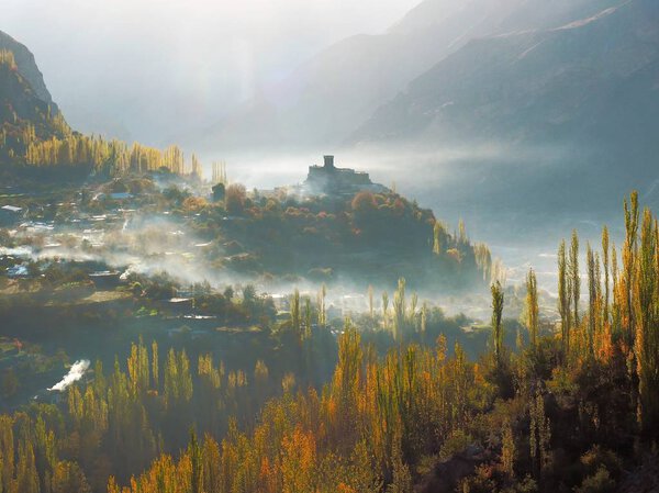 Altit Fort With Surrounding Mist And Hunza Valley In Autumn, Karimabad, Pakistan