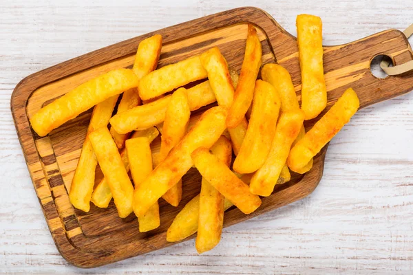 French Fries on Wooken Cooking Board — Φωτογραφία Αρχείου