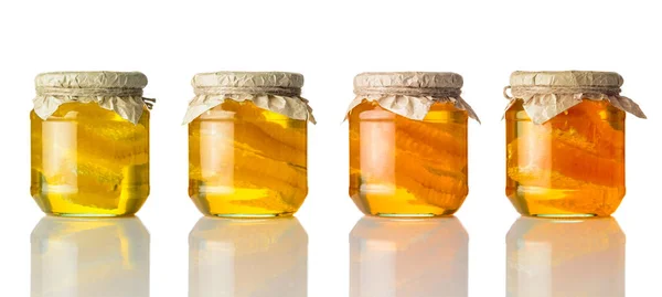 Different Colors of Honey in Jar on White Background — Stock Photo, Image