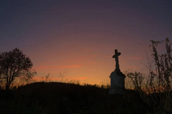 Wayside cross at sunset. There are many similar crosses in Roztocze. Everyone is different, however.